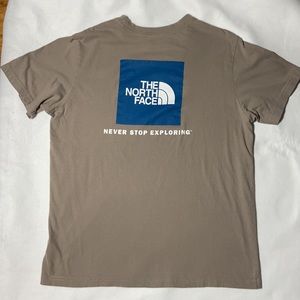 The North Face Taupe/Tan with Blue & White Logo T. X-Large.